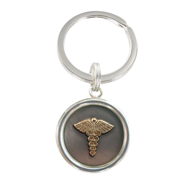 round solid keychain with gold emblem on oxidized silver background charm, sterling steel, stainless steel, custom made