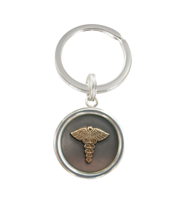 round solid keychain with gold emblem on oxidized silver background charm, sterling steel, stainless steel, custom made