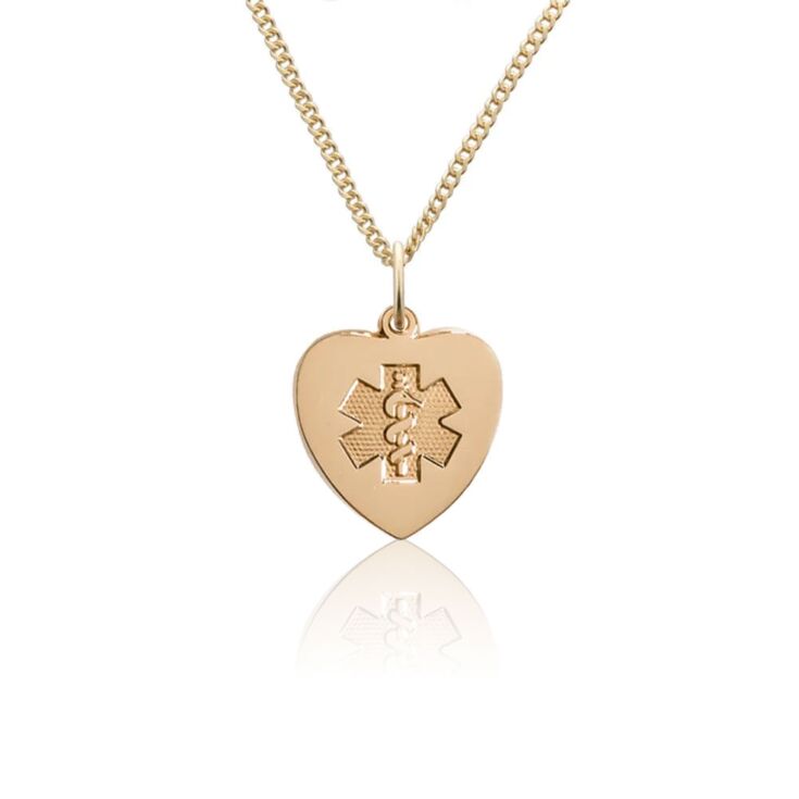 Heart-shaped gold pendant with embossed medical emblem