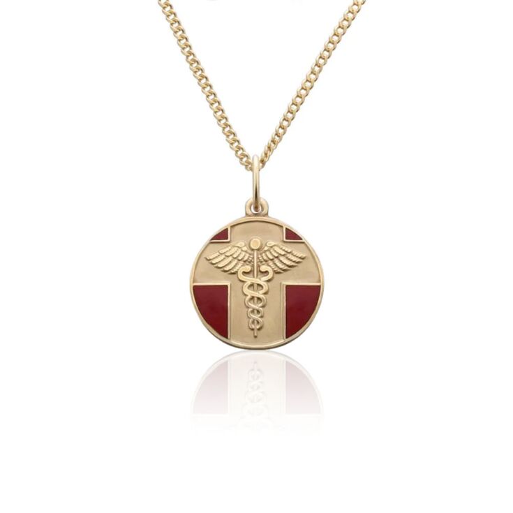 detail of gold and red, round, embossed, and vintage style medical id pendant on chain